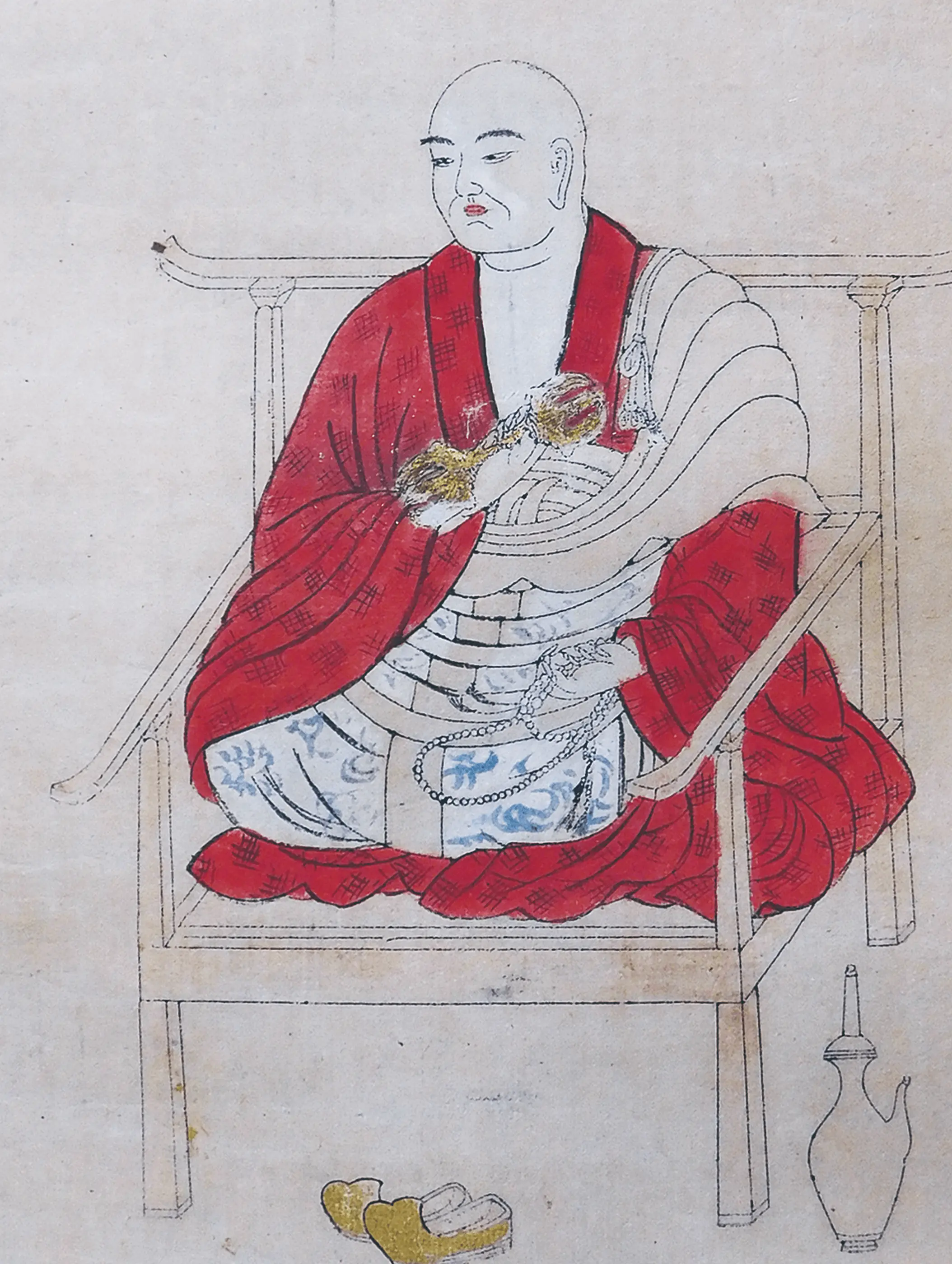 掛け軸に描かれた僧侶像を修復した後の状態で、彩色が整い線描や表情が鮮明に再現されている日本画作品。三重県伊勢市の株式会社辻村表具店による掛け軸修復の実例